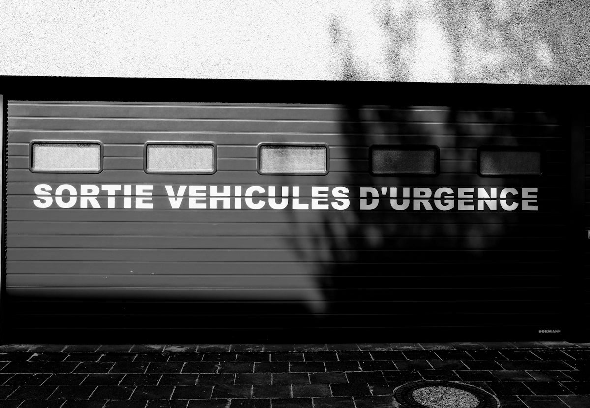 a black and white photo of a garage door