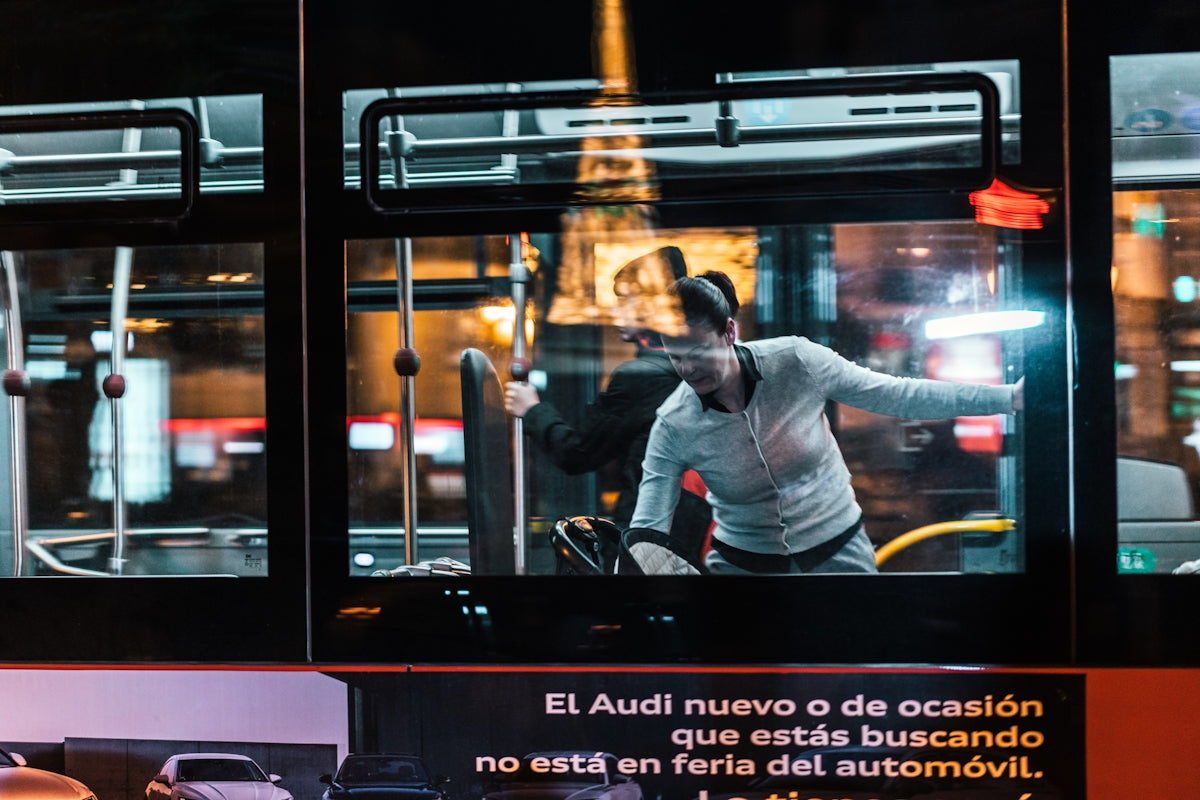 woman standing near glass wall