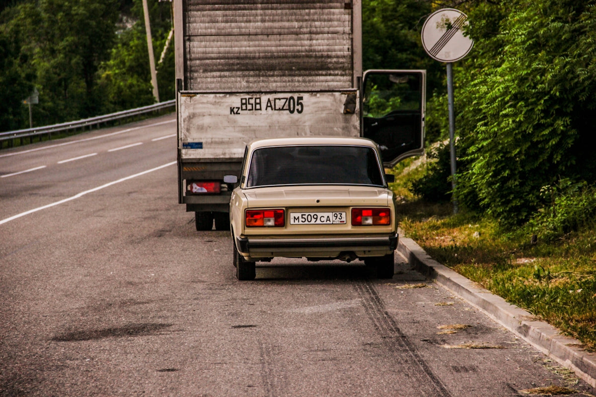 white and black car on road during daytime