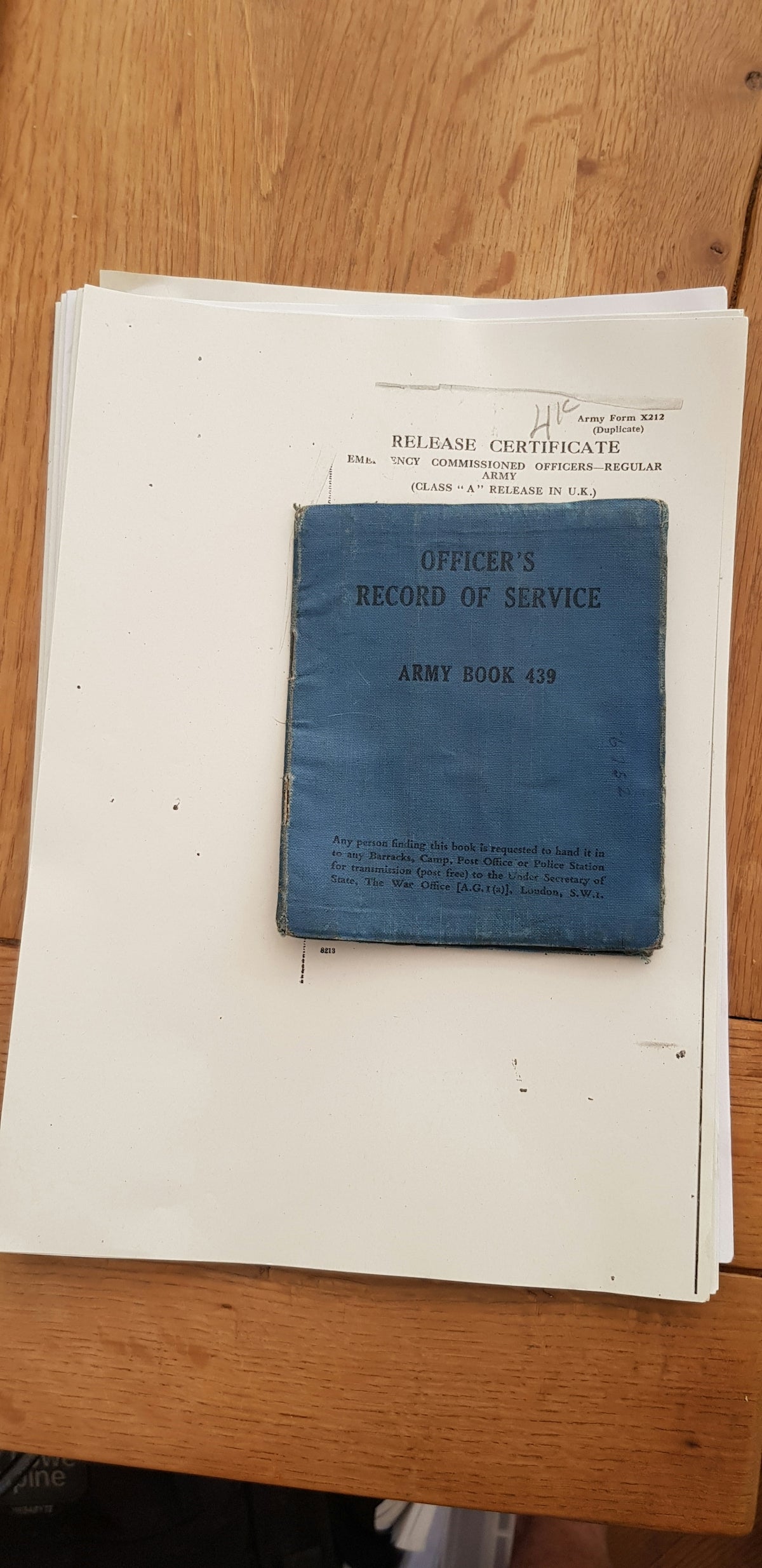 a blue book sitting on top of a wooden table