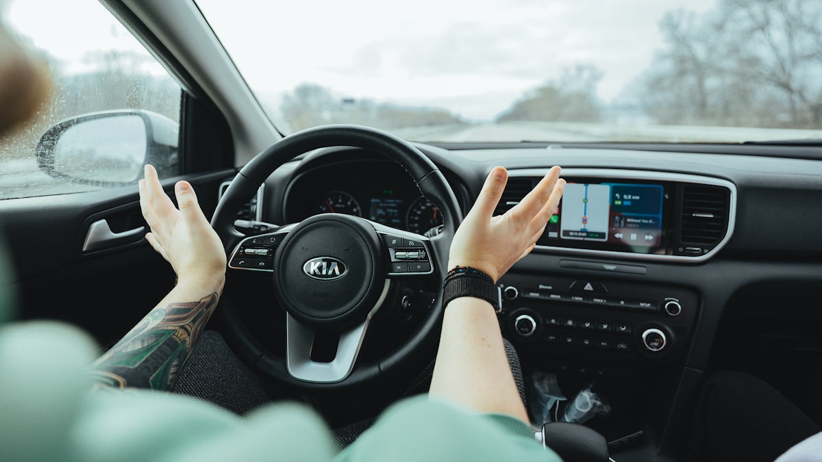 person driving car during daytime