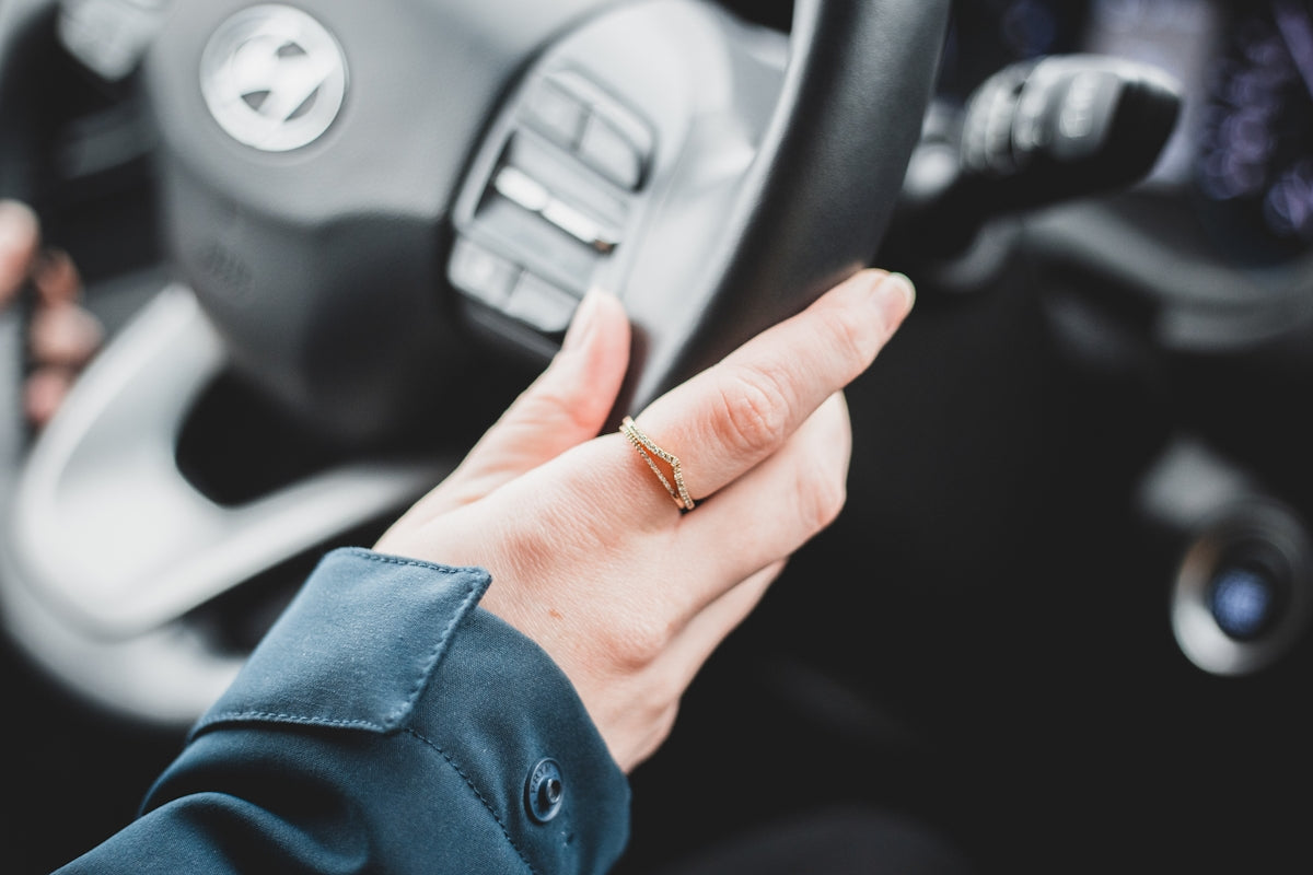 person wearing gold ring and silver ring