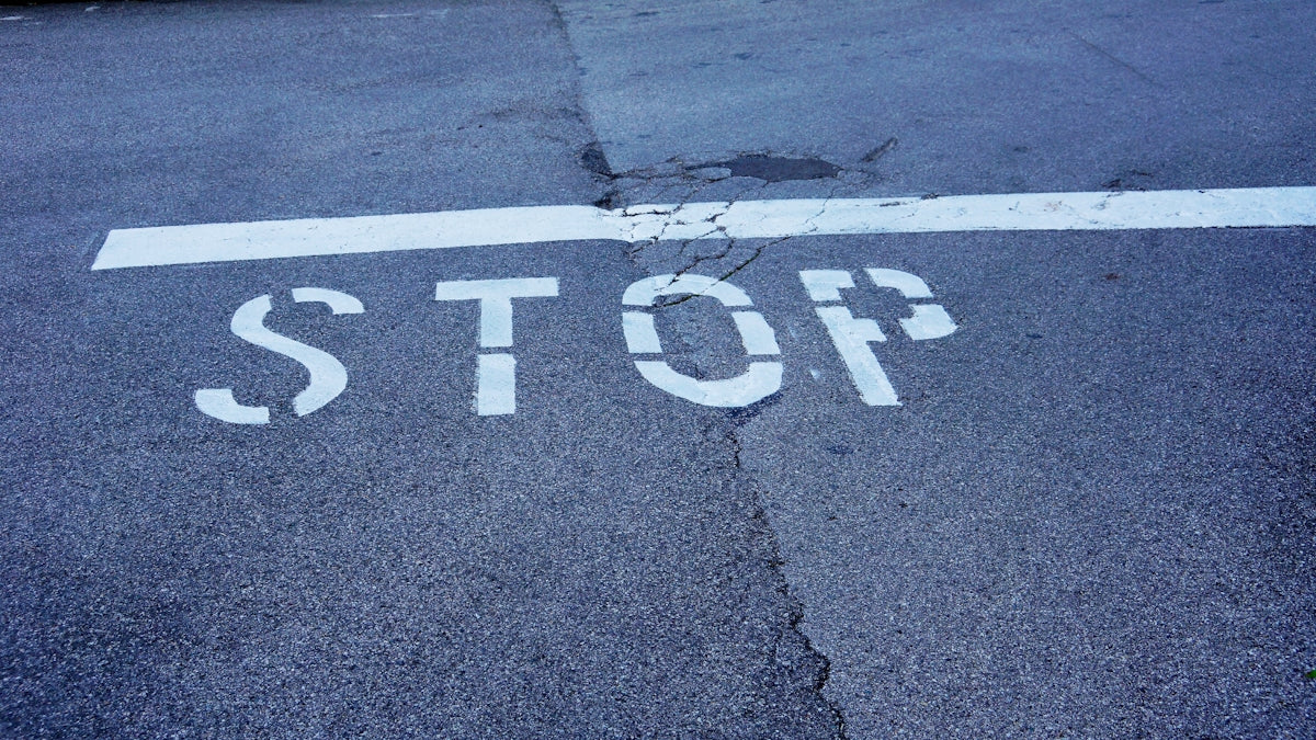 a stop sign is painted on the street