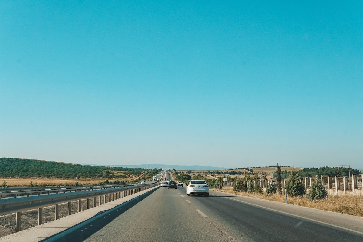 a highway with cars on it