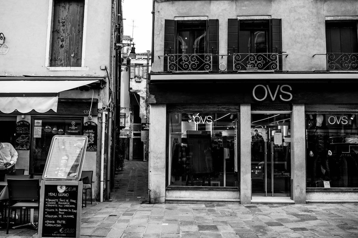 a black and white photo of a store front