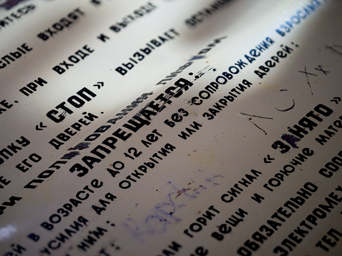 Warnings are written in russian on paper.