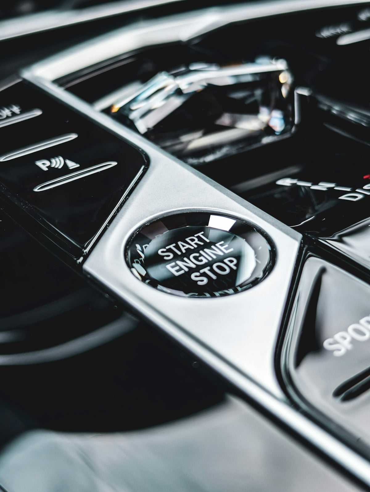 Close-up of a car's start engine stop button.