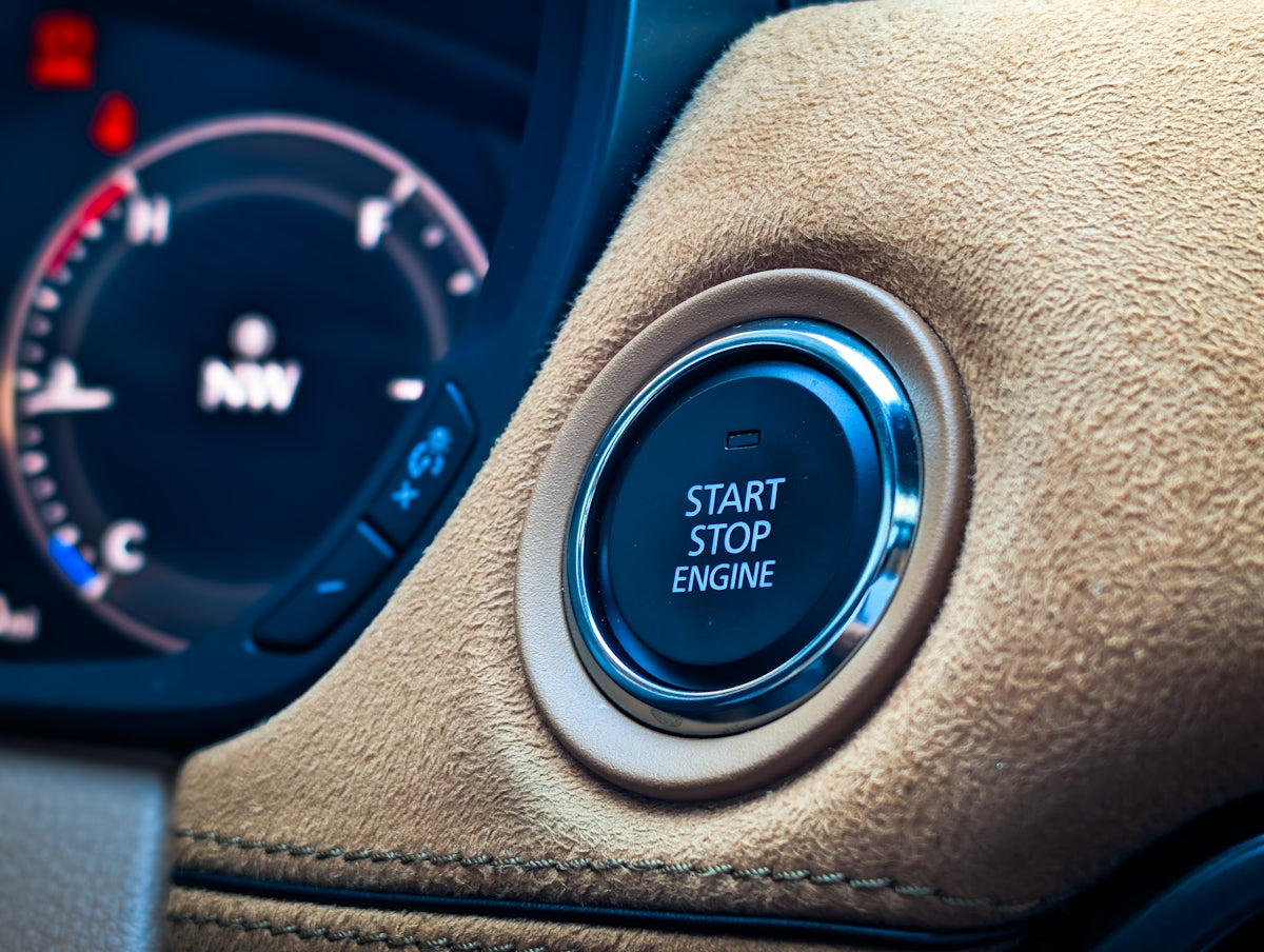 Start stop engine button in a car interior.
