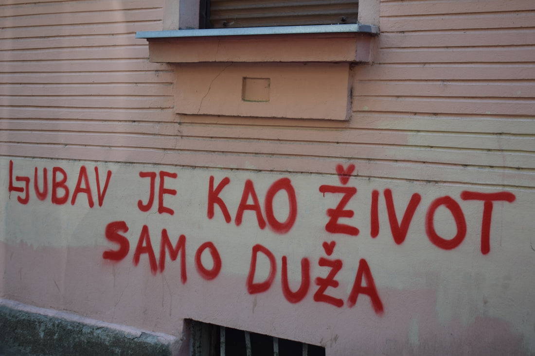 Red graffiti on a building wall
